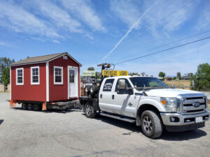 Truck delivering red ranch shed