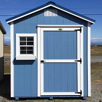 Blue Ranch Shed with white trims and flower box